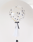 round confetti filled balloon with tassel and balloon weight