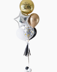 graduation balloons featuring a round gold orb, star, and latex balloons in black, gold, and white colors