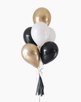 graduation balloon bouquet in black, white, cream and gold colors on a white background