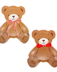 Two brown teddy bears with red bows on a white background