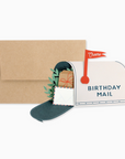 A birthday mail mailbox card with a brown envelope and a decorative stamp, placed on a white background.
