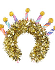Gold tinsel with colorful birthday candles on a headband