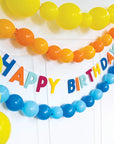 Colorful banner with 'Happy Birthday' text and balloons on a white background
