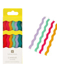 Pack of colorful wavy candles with packaging on a white background