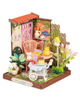 Miniature garden DIY kit with table and decorative items on a white background