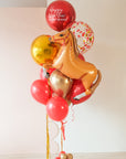 A balloon bouquet celebrating lunar new year, with a horse, red, gold, and confetti balloons