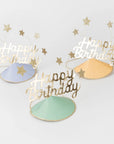 Three 'Happy Birthday' hats with gold stars on a light gray background