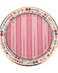 Decorative paper plate with pink center and candy-themed border on a white background