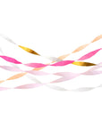 paper streamers hung across in pinks and gold