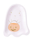 A pink ghost-shaped paper party plate featuring a cute gold cartoon face and an orange jack-o'-lantern bucket