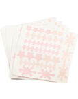 Stack of pink floral-patterned napkins on a white background