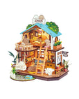 miniature dollhouse with puppy theme on a white background
