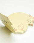 Cat-shaped sticky note pad on a white background