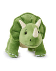 A plush toy resembling a green Triceratops dinosaur with white horns and a brown belt.