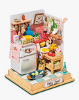 A DIY miniature dollhouse kitchen kit, with a variety of small toy kitchen items and a wooden base, designed for assembly.
