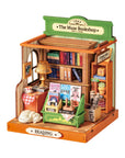 miniature of a bookshop with books and stationery items on a white background
