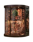 miniature dollhouse of two story library with staircases, on white background
