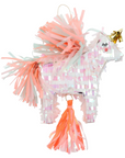 A pink unicorn-shaped piñata with neon tassels and gold foil details, containing confetti and temporary tattoos inside.
