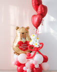 balloon cloud on the floor with capybara valentine's day balloon and daisy balloons