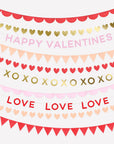 strands of valentine's themed garlands and text on white background, with words such as love, xoxo, and happy valentines