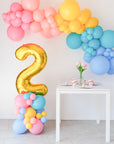 rainbow balloon garland and number balloon stack set