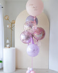 Bouquet of latex and mylar balloons in shades of pink and lavender.