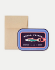 A greeting card with a 3D die-cut design resembling a can of sardines, accompanied by a brown envelope. The card has a blue and red fish graphic with text that reads 'Hello, friend' on the front, and an inside message that reads 'Glad we're tight.