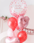 valentine's day themed bouqeut with red and pink balloons