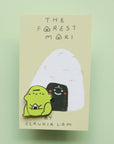 blob frog enamel pin holding rice ball