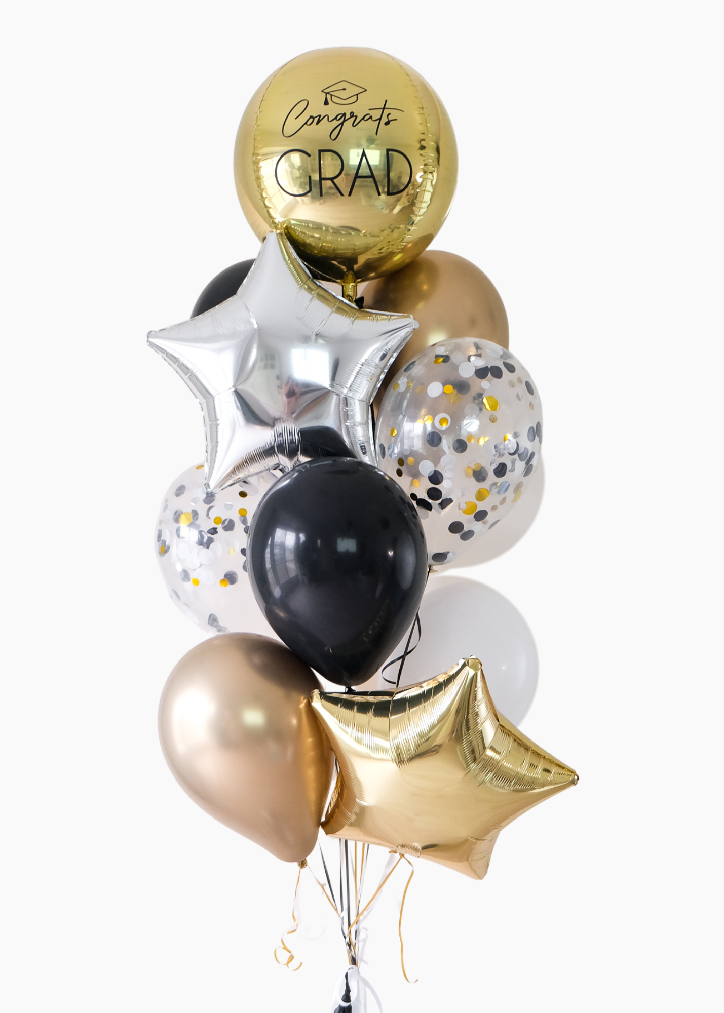 gold, black, white, cream, and silver graduation balloons