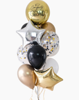 gold, black, white, cream, and silver graduation balloons