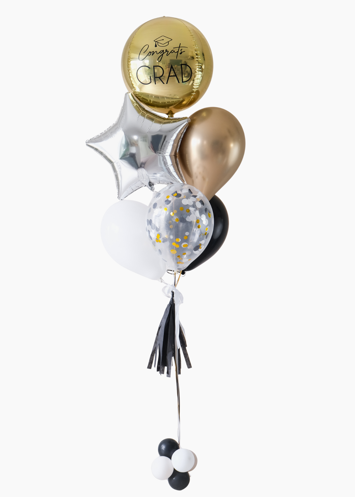graduation balloons featuring a round gold orb, star, and latex balloons in black, gold, and white colors
