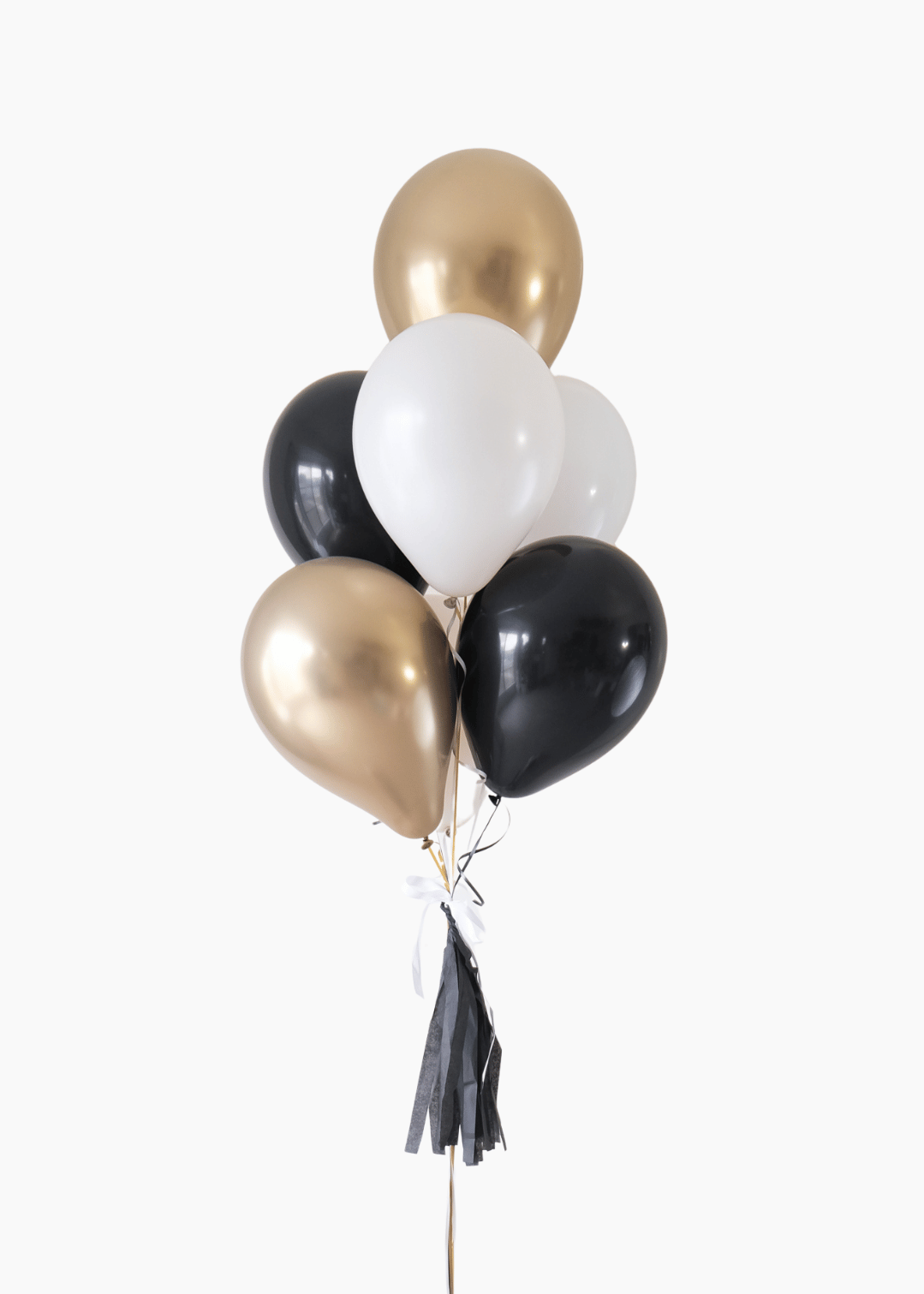 graduation balloon bouquet in black, white, cream and gold colors on a white background