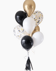 graduation balloon bouquet in black, white, cream. confetti-filled, and gold colors on a white background