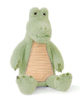 A plush green alligator toy with a beige striped belly and brown feet.