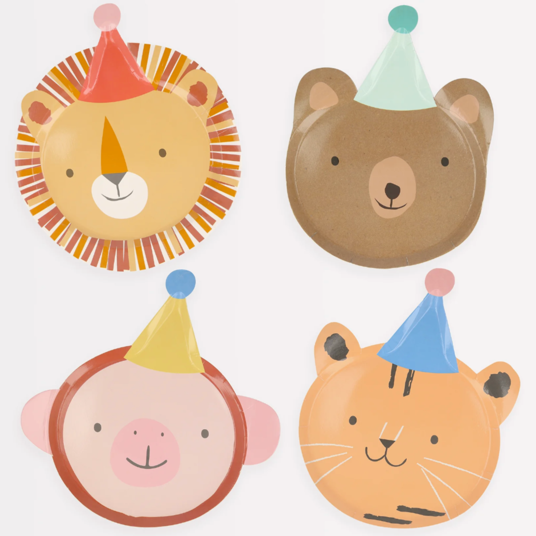 A set of four die-cut plates with animal designs including a bear, a monkey, a tiger, and a lion, each with a birthday hat on.