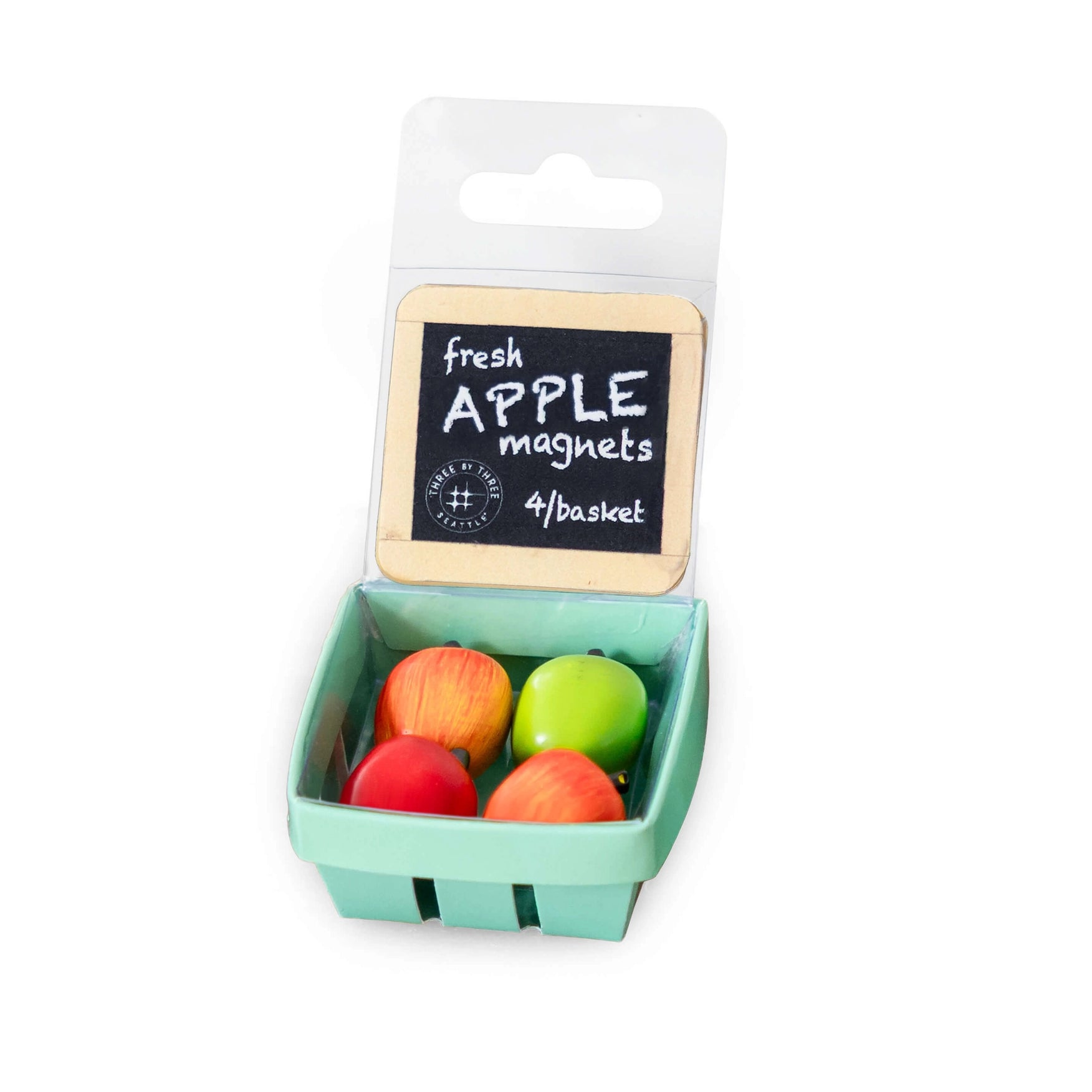 Packaged apple-shaped magnets with a basket design on a white background