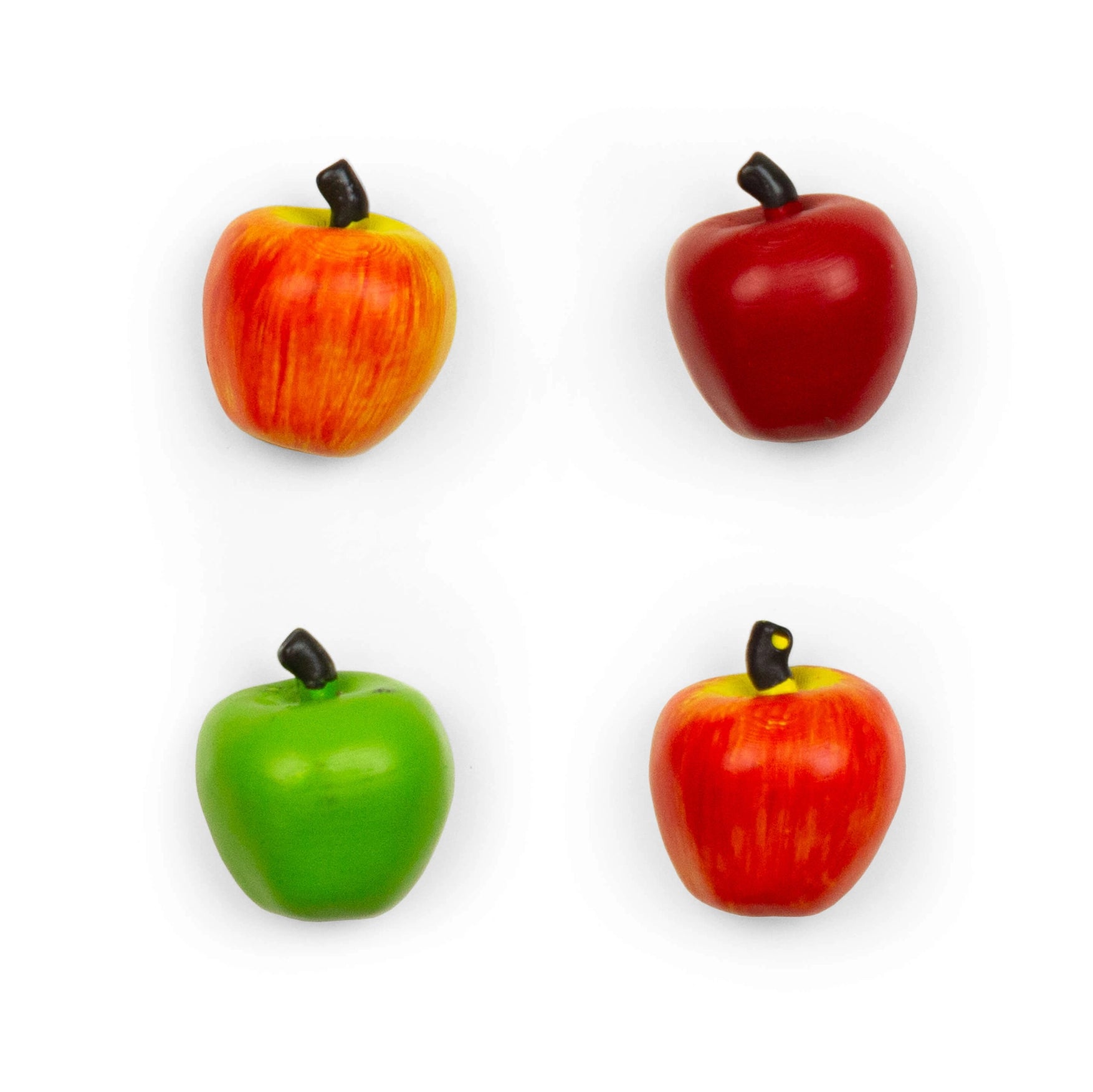 Four small apple-shaped items including two red apples and two green/red apples, each with a dark stem.