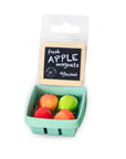 Packaged apple-shaped magnets with a basket design on a white background