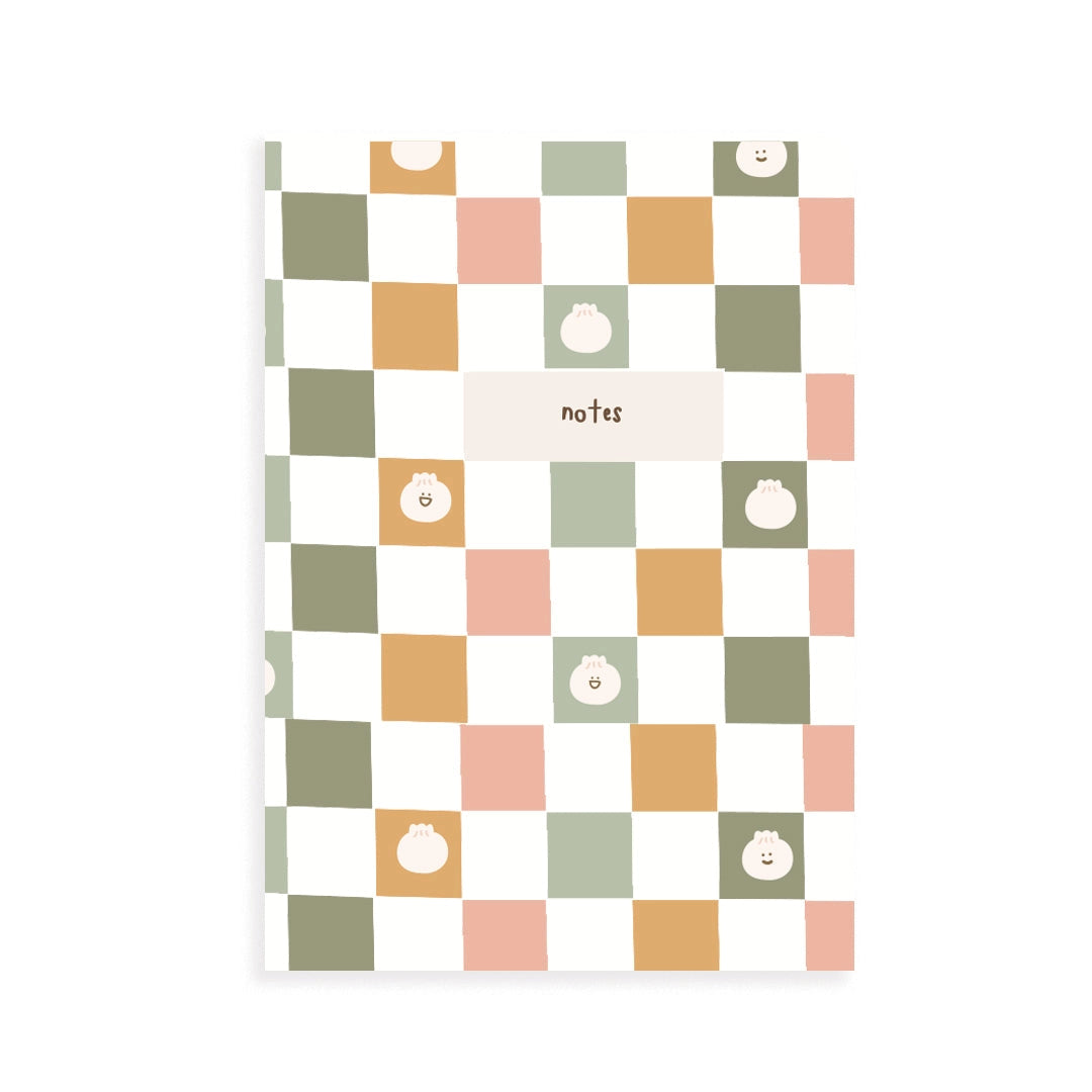 Notebook with a colorful checkered pattern and dumpling icons on a white background