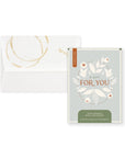 A decorative paper confetti filled bag designed to look like a tea bag, with a matching envelope, for a total gift size of 3.8 x 5.