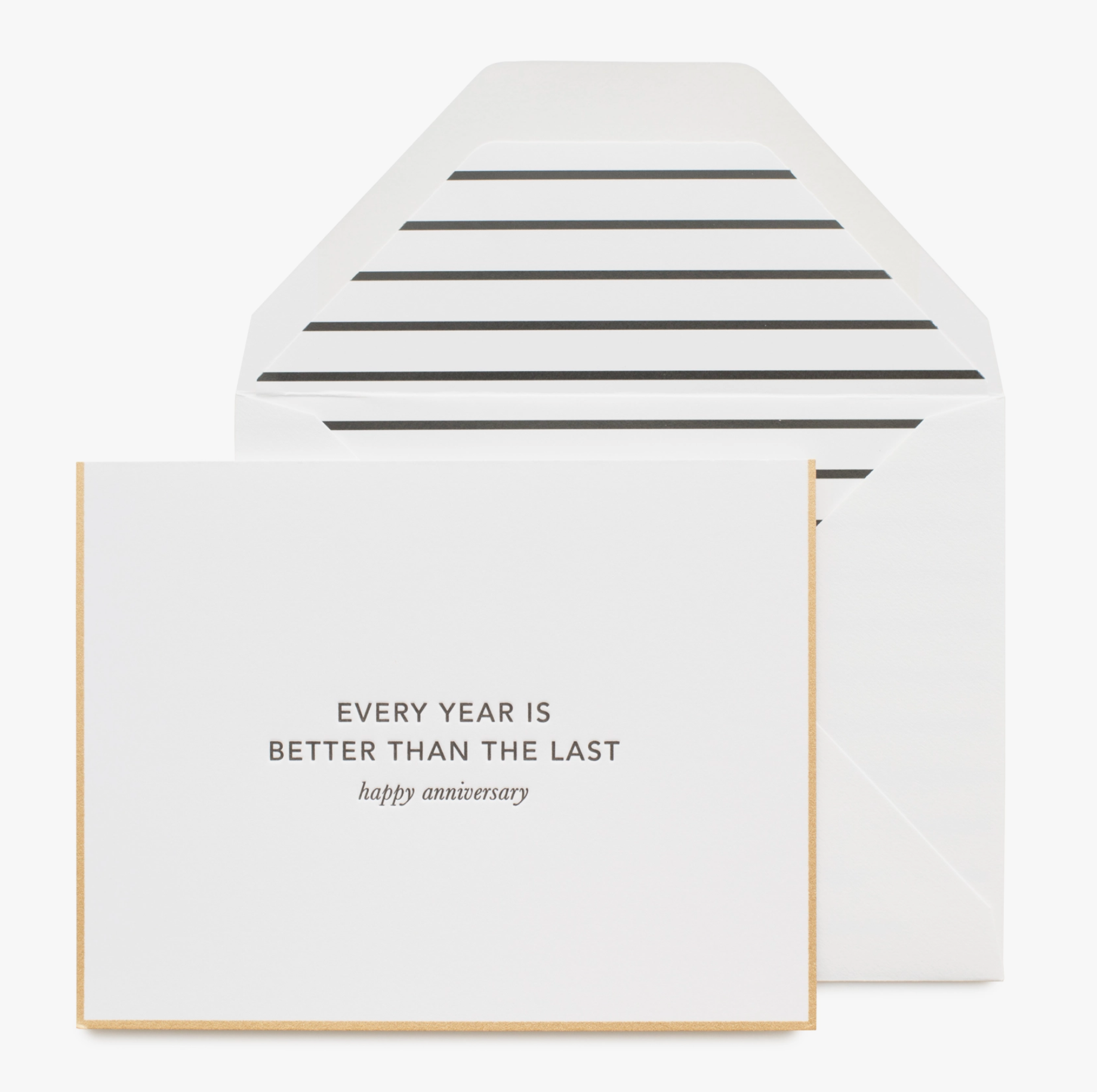 An anniversary card with 'Every Year is Better Than the Last' printed in gold foil on a white background, accompanied by a matching envelope.