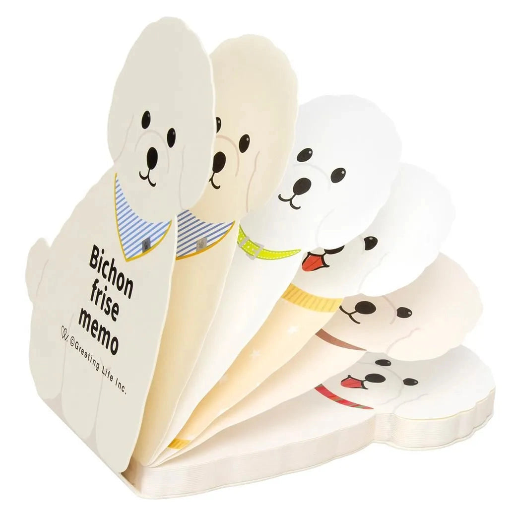 Dog-shaped memo pads with cartoon faces on a white background