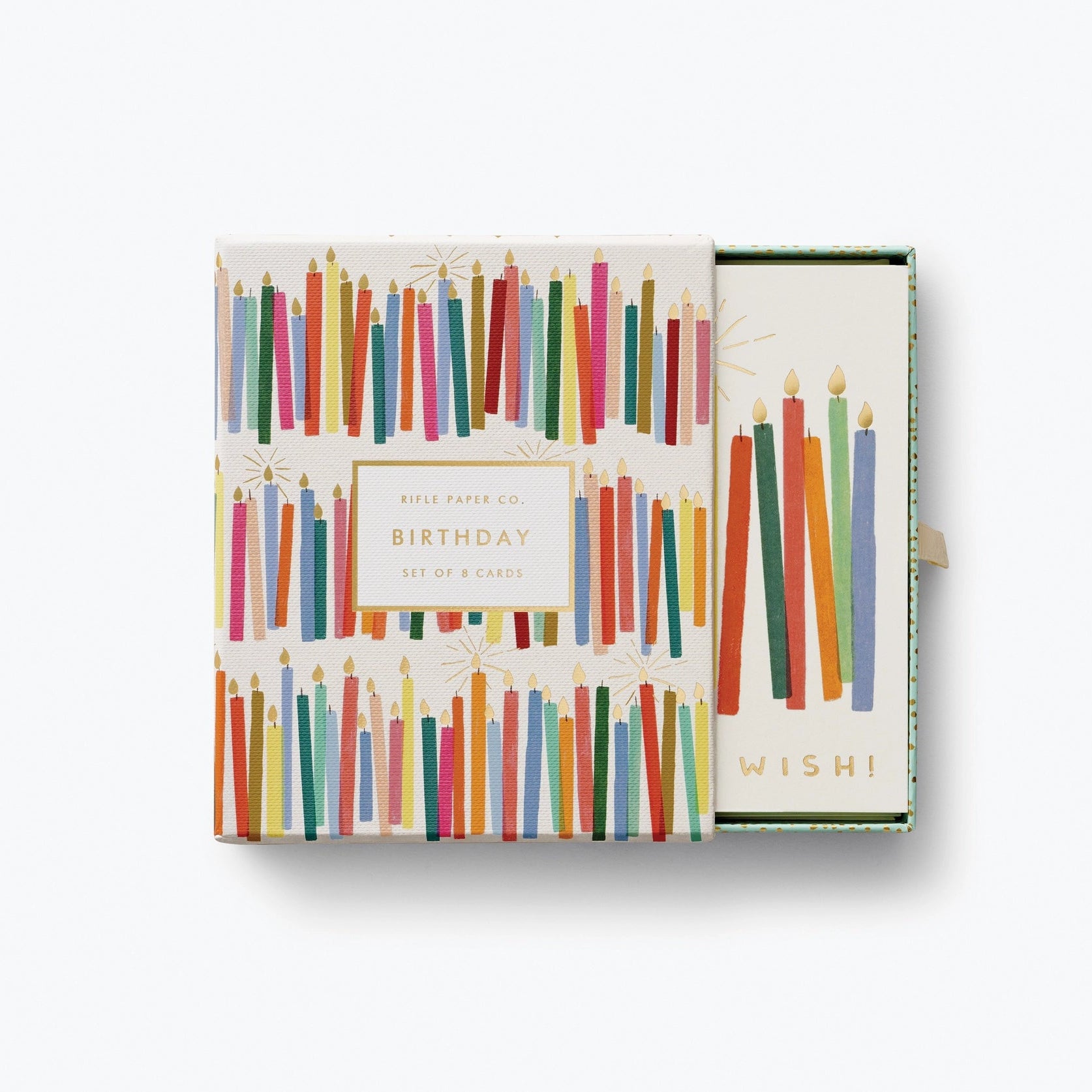 A box of cards with color prints of candles