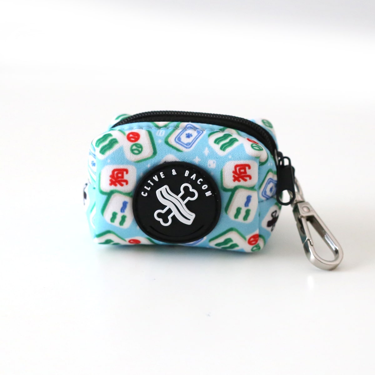 Small pet waste pouch with mahjong tile design and visible brand logo on a white background