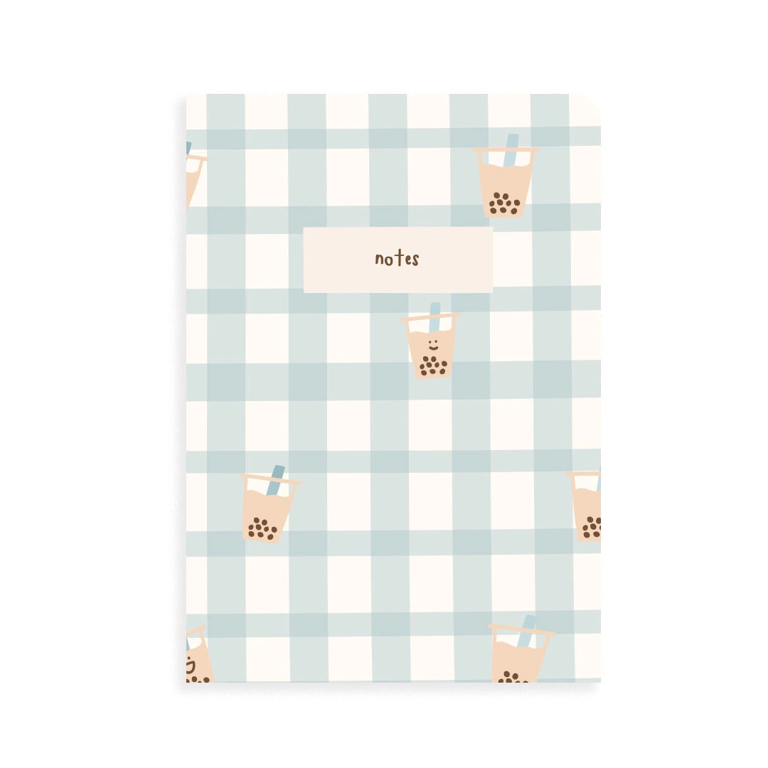 Notebook with blue plaid pattern and boba drink illustrations on a white background