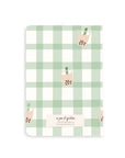 Notebook with green plaid pattern and boba tea illustration on a white background