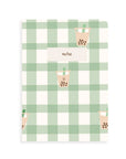 Notebook with green plaid pattern and boba design on a white background