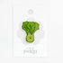 smiley green vegetable pin on white background