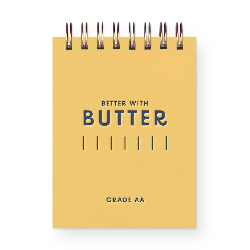 Yellow notebook with 'Better with Butter' text on a white background
